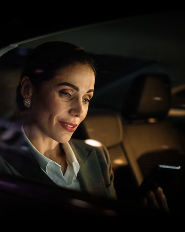 woman with mobile in luxury car – alf